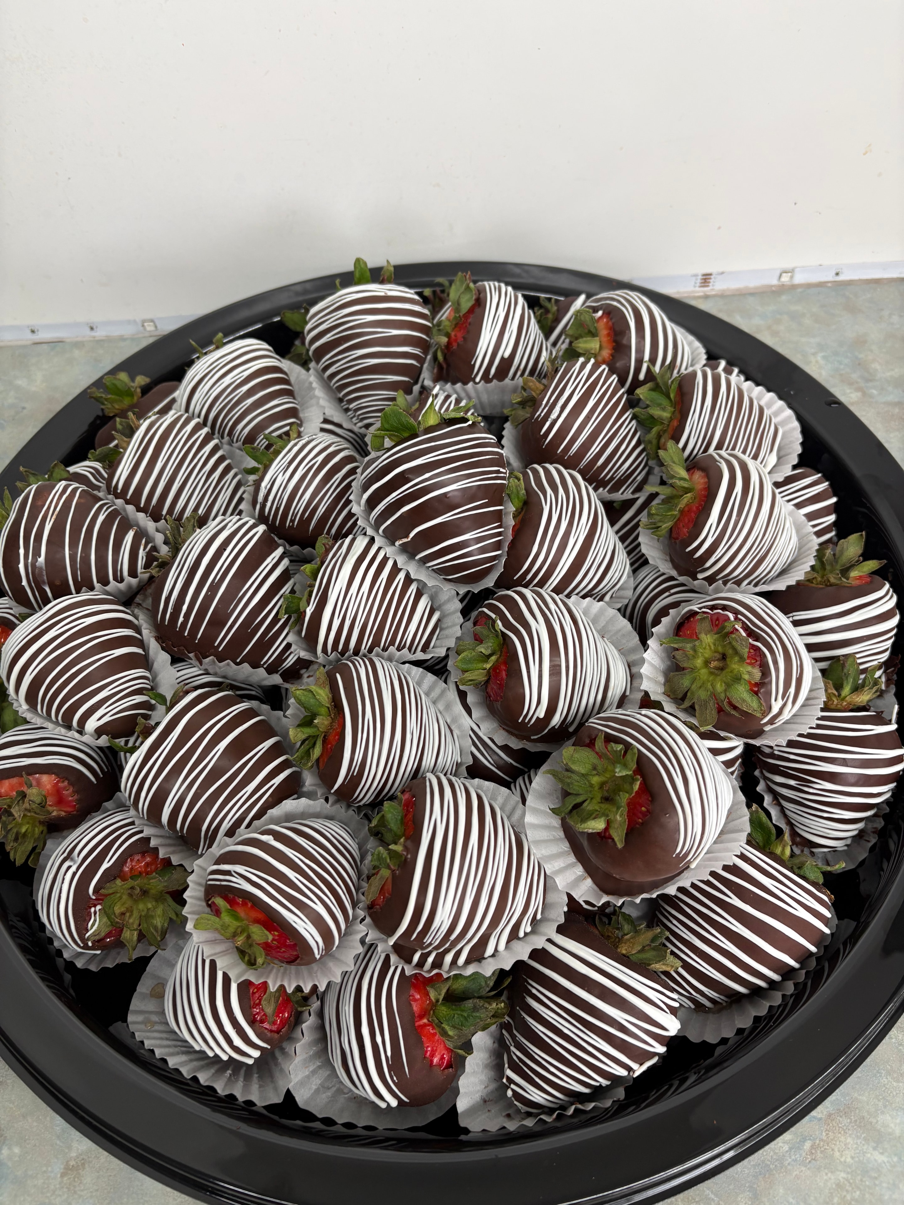 Chocolate covered strawberries on a tray